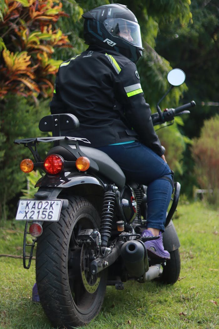 A female biker enjoying an outdoor motorcycle ride in Madikeri, India.
